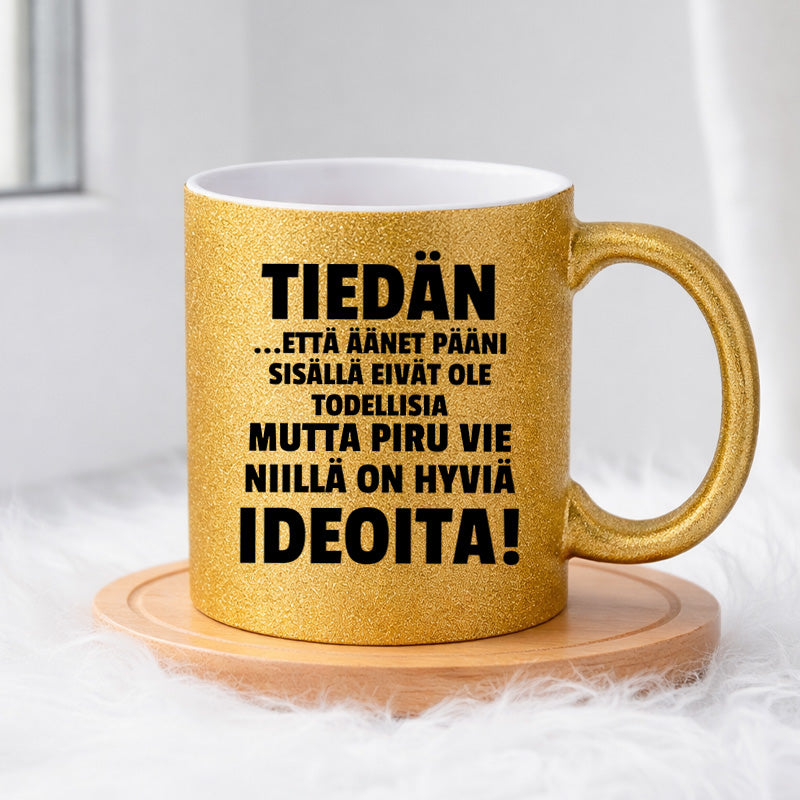 Tiedän että äänet pääni sisällä (0378) | Glittermuki 330ml